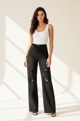 Premium distressed wide-leg denim pants in matte black - front pose
