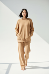 Luxury Oversized Sweatshirt Lounge Set — Warm Sand Beige, Walking with Hands in Pocket