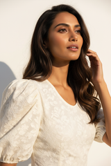 Puff-Sleeve Blouse in Floral Cream - Close Up Hand in Hair