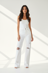 Premium distressed wide-leg denim pants in white - front pose