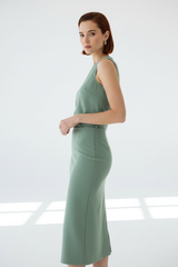 Women's elegant midi skirt set in sage green, three-quarter turn pose