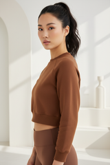 Luxury cropped sweatshirt in Warm Cocoa, three-quarter turn pose
