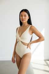 Luxury Twist-Front Bodysuit in Soft Ivory - Three-Quarter View