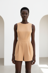 Luxury sleeveless romper in Warm Beige – front view