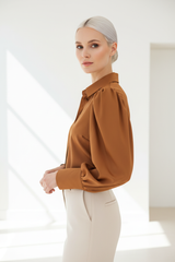 Luxury puff-sleeve shirt in Warm Toffee Brown, three-quarter turn pose