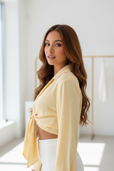 Luxury cropped front-tie shirt in Buttercream Yellow, three-quarter turn pose