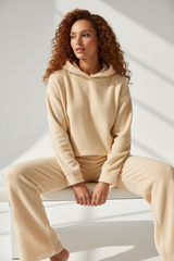 Luxury Fleece Hoodie Lounge Set — Warm Cream, Seated on Bench