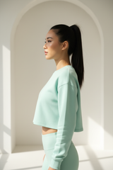Luxury cropped sweatshirt in Ice Mint, side profile pose
