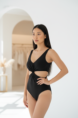 Luxury Twist-Front Bodysuit in Matte Black - Three-Quarter View