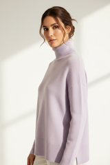 Luxury turtleneck sweater in Powder Lilac, three-quarter turn pose