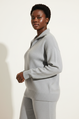 Luxury zip-neck sweater in Frosted Grey, three-quarter turn pose
