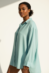 Luxury linen oversized shirt in Ocean Aqua, three-quarter turn pose