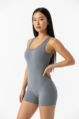 Seamless Body Sculpting Workout Jumpsuit in Stone Grey — Three-Quarter Angle
