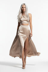 Women's satin slit skirt set in soft beige, dynamic walking pose