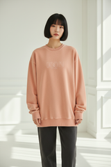 Luxury graphic sweatshirt in Washed Peach, front facing pose