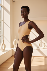 Luxe One-Shoulder Cutout Swimsuit in Champagne Beige – three-quarter pose