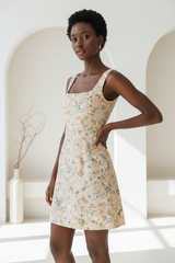 Luxury Square-Neck Mini Dress in Floral Beige - hand on hip pose