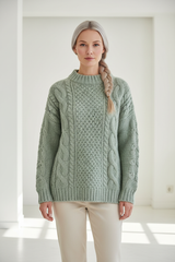 Luxury cable-knit sweater in Sage Mist, front facing pose