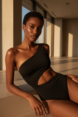 Luxe One-Shoulder Cutout Swimsuit in Matte Black – editorial pose