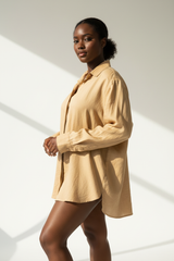 Luxury linen oversized shirt in Desert Beige, three-quarter turn pose