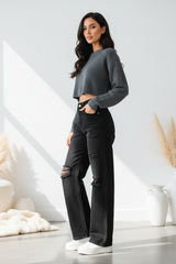 Premium distressed wide-leg denim pants in matte black - side profile