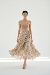 Women's floral wrap skirt set in floral beige, graceful walking pose