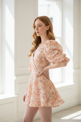 Luxury puff-sleeve romper in Floral Peach – side profile