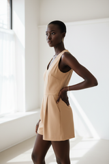 Luxury sleeveless romper in Warm Beige – side profile