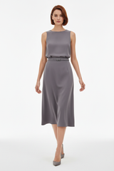 Women's elegant midi skirt set in soft grey, graceful walking pose