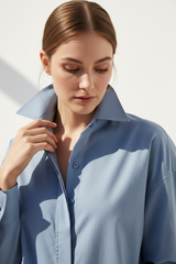 Oversized cotton shirt in Sky Mist Blue, detail close-up of collar and fabric