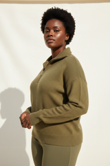 Luxury zip-neck sweater in Olive Khaki, three-quarter turn pose
