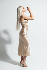 Women's satin slit skirt set in champagne gold, side profile pose