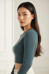 Luxury cropped ribbed sweater in Smoky Teal, three-quarter turn pose