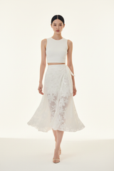 Women's floral wrap skirt set in floral white, graceful walking pose