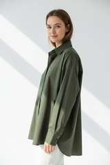 Oversized cotton shirt in Forest Olive, three-quarter turn pose