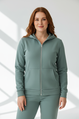 Luxury zip-up hoodie in Dusty Sage, front facing pose