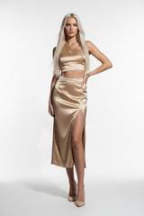 Women's satin slit skirt set in champagne gold, front-facing pose