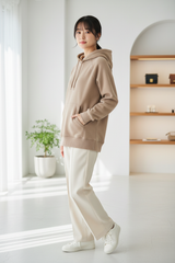 Luxury pullover hoodie in Stone Sand, three-quarter turn pose