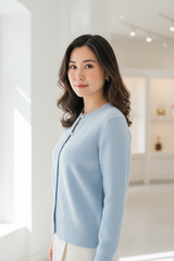 Luxury cardigan sweater in Ice Blue, three-quarter turn pose