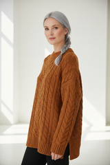 Luxury cable-knit sweater in Warm Cinnamon, three-quarter turn pose