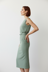 Women's elegant midi skirt set in sage green, side profile pose