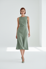 Women's elegant midi skirt set in sage green, graceful walking pose