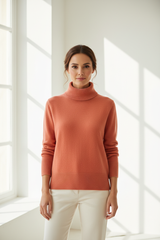Luxury turtleneck sweater in Muted Coral, front facing pose