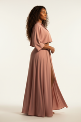 Women's flowy maxi skirt set in dusty rose, side profile pose