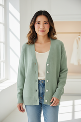 Luxury cardigan sweater in Soft Pistachio, front facing pose