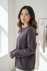 Luxury cardigan sweater in Charcoal Plum, three-quarter turn pose