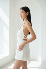 Luxury backless halter romper in Ivory White – side profile