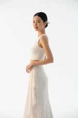 Women's floral wrap skirt set in floral white, three-quarter turn pose