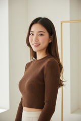 Luxury cropped ribbed sweater in Deep Cocoa Brown, three-quarter turn pose