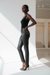 Premium Women's Faux Leather Slim-Fit Pants in Matte Black - Three Quarter View